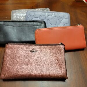 Coach Leather Wallets in Black, Gray, and Brown